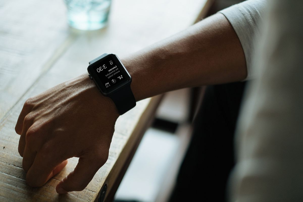 man wearing black smartwatch